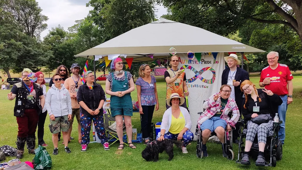 A joyous shot of folk assembled on the Meadows for Autistic Pride.